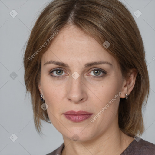 Joyful white adult female with medium  brown hair and grey eyes