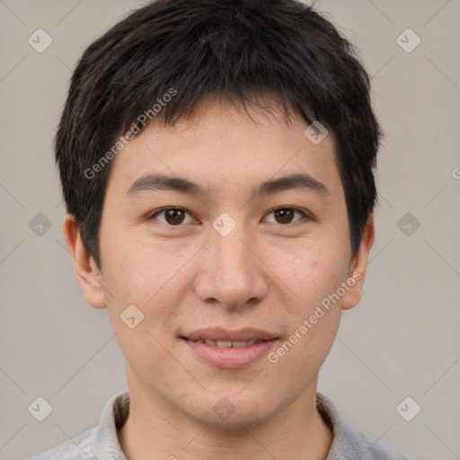 Joyful asian young-adult male with short  brown hair and brown eyes