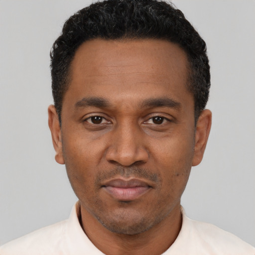 Neutral latino adult male with short  black hair and brown eyes