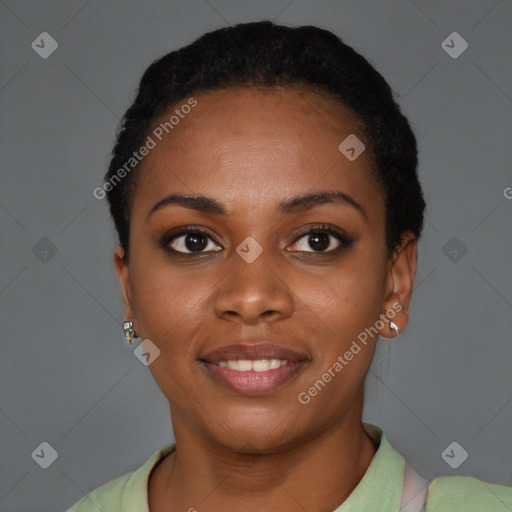 Joyful black young-adult female with short  black hair and brown eyes