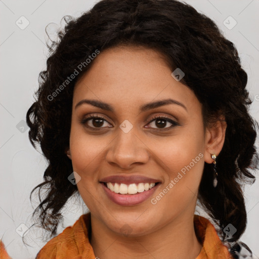 Joyful black young-adult female with long  brown hair and brown eyes