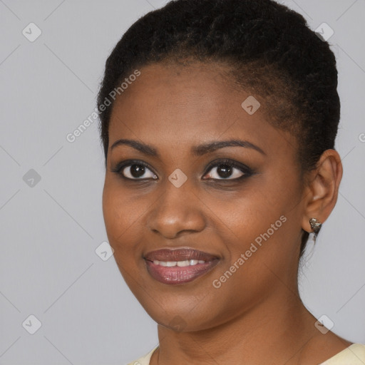 Joyful black young-adult female with short  black hair and brown eyes