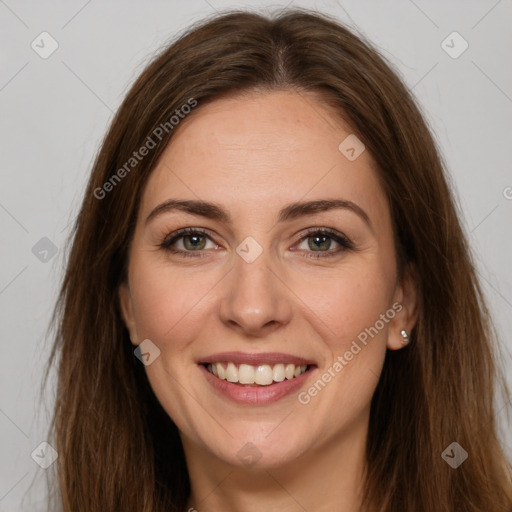 Joyful white young-adult female with long  brown hair and green eyes