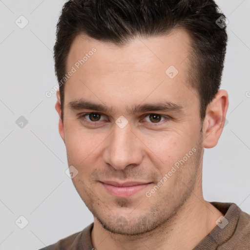 Joyful white young-adult male with short  brown hair and brown eyes