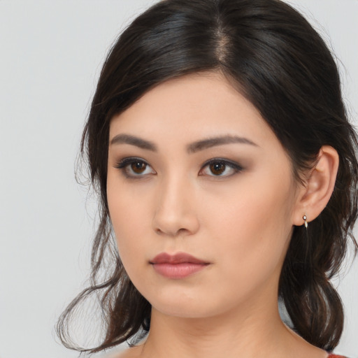 Neutral asian young-adult female with long  brown hair and brown eyes