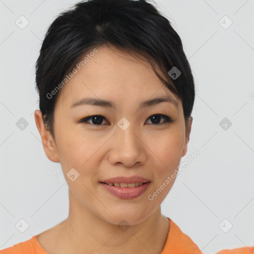 Joyful asian young-adult female with short  brown hair and brown eyes