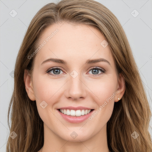 Joyful white young-adult female with long  brown hair and green eyes