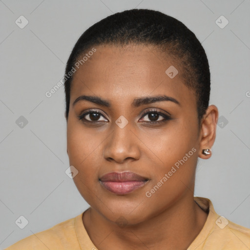 Joyful black young-adult female with long  black hair and brown eyes