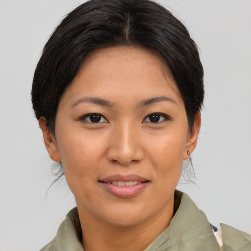Joyful asian young-adult female with short  brown hair and brown eyes