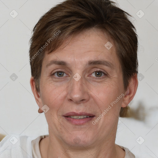 Joyful white adult female with short  brown hair and brown eyes