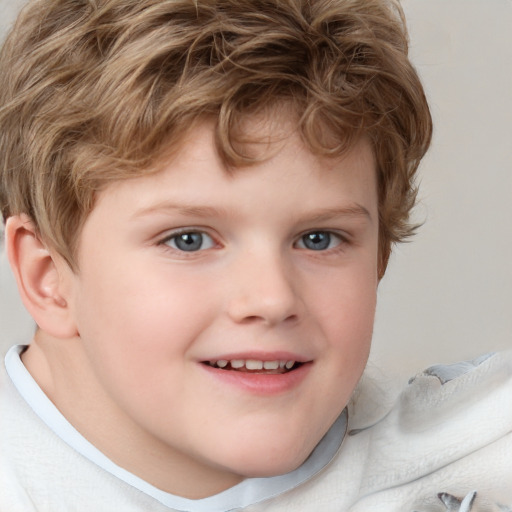 Joyful white child male with short  brown hair and grey eyes