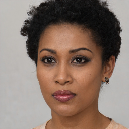 Neutral black young-adult female with short  brown hair and brown eyes
