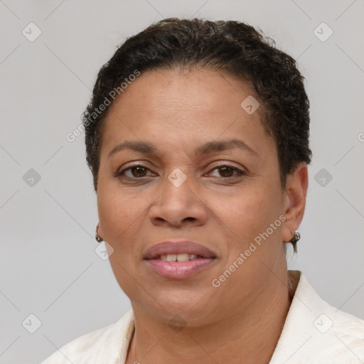 Joyful latino adult female with short  brown hair and brown eyes