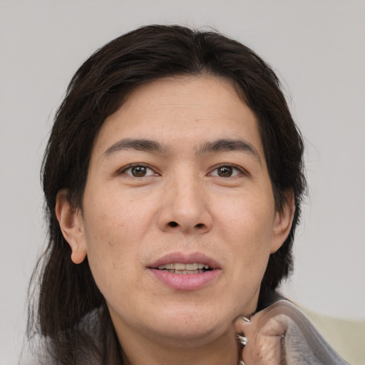 Joyful white adult male with medium  brown hair and brown eyes