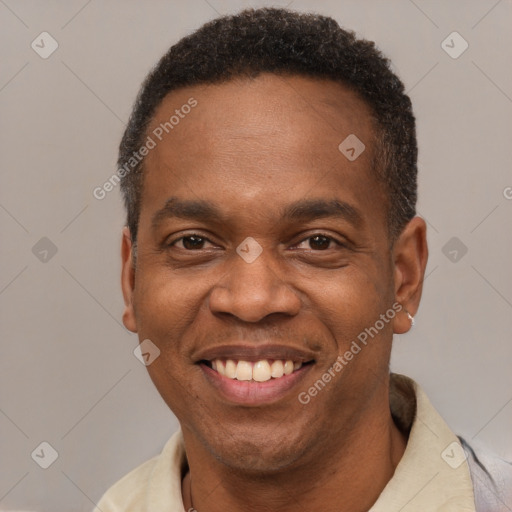 Joyful latino adult male with short  brown hair and brown eyes