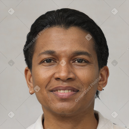 Joyful black adult male with short  black hair and brown eyes