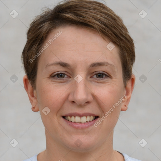 Joyful white adult female with short  brown hair and grey eyes