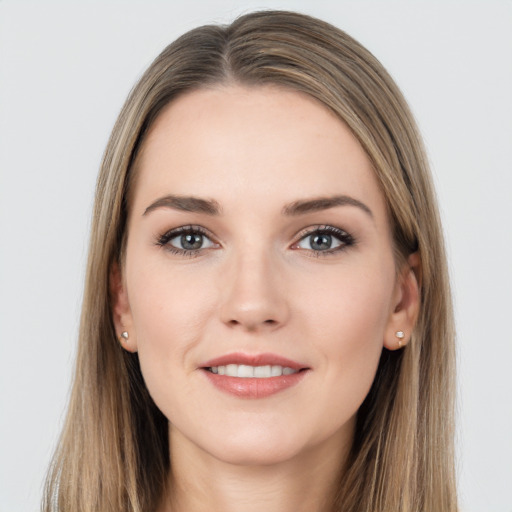 Joyful white young-adult female with long  brown hair and grey eyes