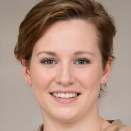 Joyful white young-adult female with medium  brown hair and blue eyes