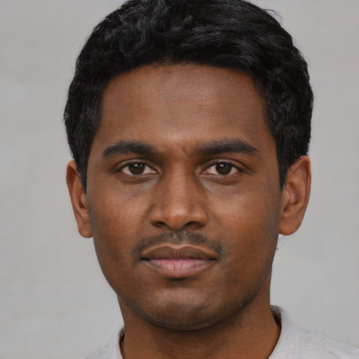 Neutral black young-adult male with short  black hair and brown eyes