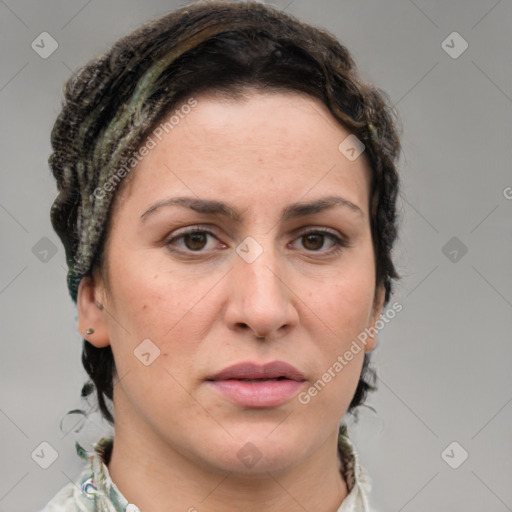 Joyful white adult female with medium  brown hair and grey eyes