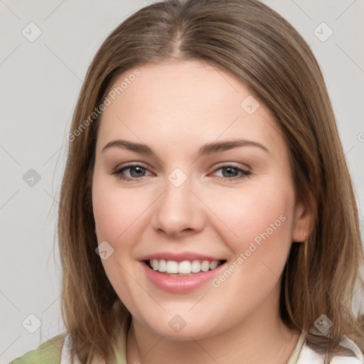 Joyful white young-adult female with medium  brown hair and green eyes