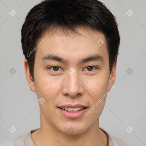 Joyful asian young-adult male with short  brown hair and brown eyes