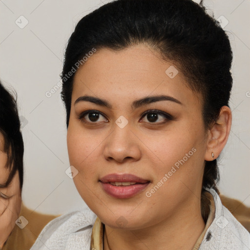 Joyful latino young-adult female with medium  brown hair and brown eyes