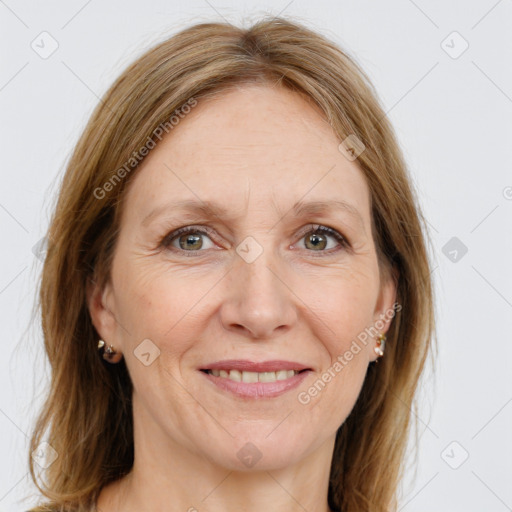 Joyful white adult female with long  brown hair and grey eyes