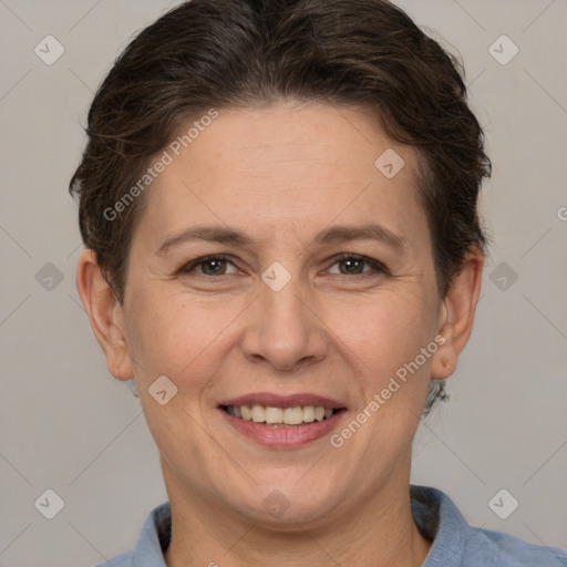 Joyful white adult female with short  brown hair and brown eyes