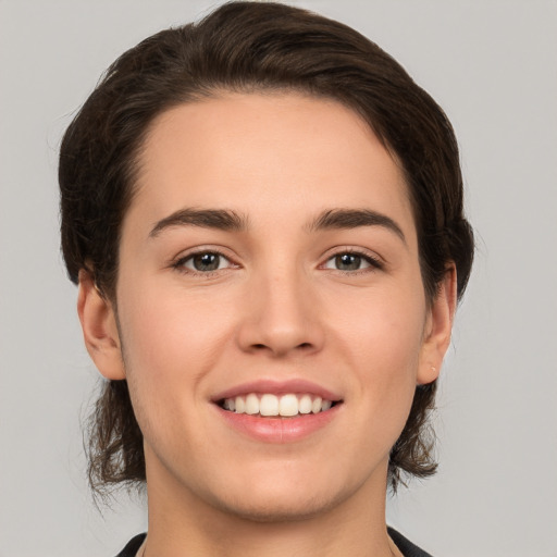 Joyful white young-adult female with medium  brown hair and brown eyes