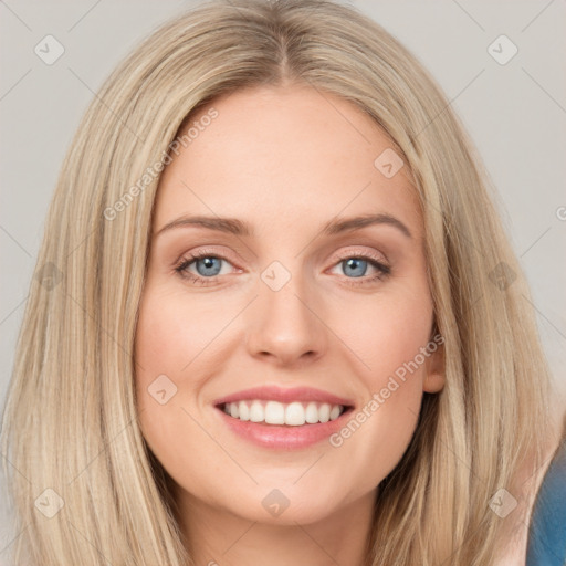 Joyful white young-adult female with long  brown hair and blue eyes