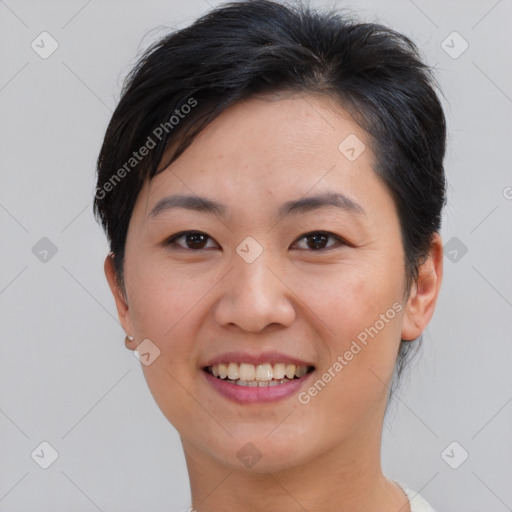 Joyful asian young-adult female with short  brown hair and brown eyes