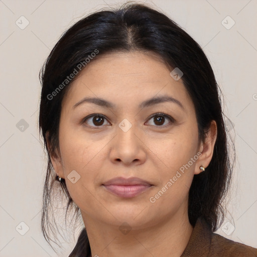 Joyful white adult female with medium  brown hair and brown eyes