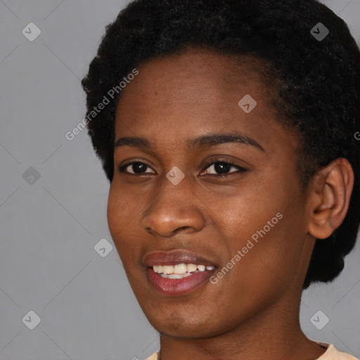 Joyful black young-adult female with short  black hair and brown eyes