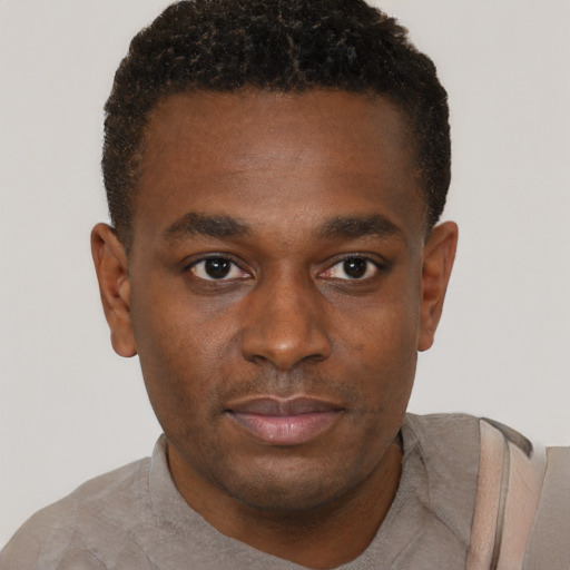 Neutral black young-adult male with short  brown hair and brown eyes