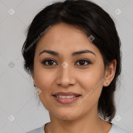 Joyful latino young-adult female with medium  brown hair and brown eyes