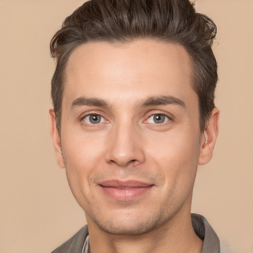 Joyful white adult male with short  brown hair and brown eyes