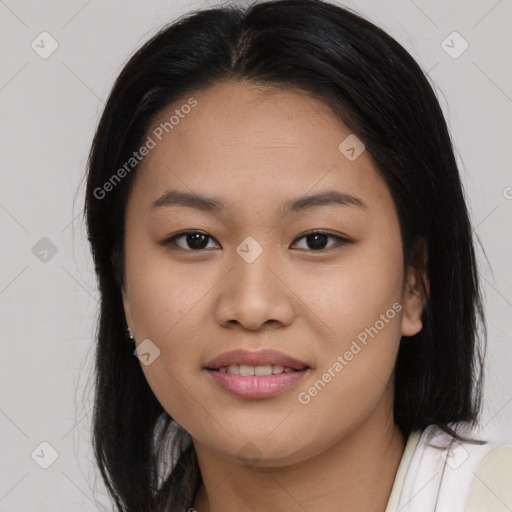 Joyful asian young-adult female with long  brown hair and brown eyes