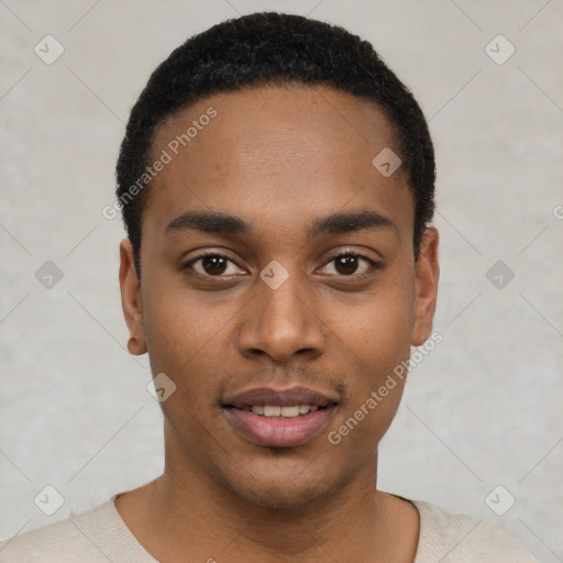 Joyful black young-adult male with short  black hair and brown eyes