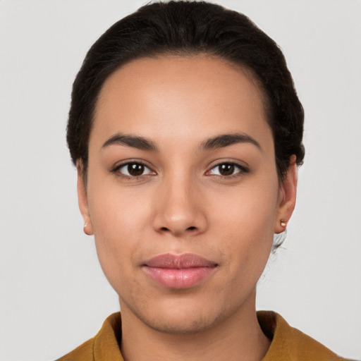 Joyful latino young-adult female with short  brown hair and brown eyes