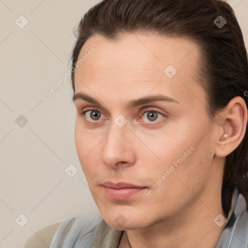 Neutral white young-adult male with long  brown hair and brown eyes