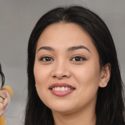 Joyful white young-adult female with long  black hair and brown eyes