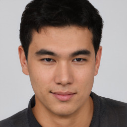 Neutral asian young-adult male with short  brown hair and brown eyes