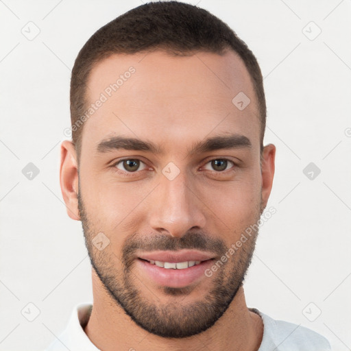 Joyful white young-adult male with short  brown hair and brown eyes