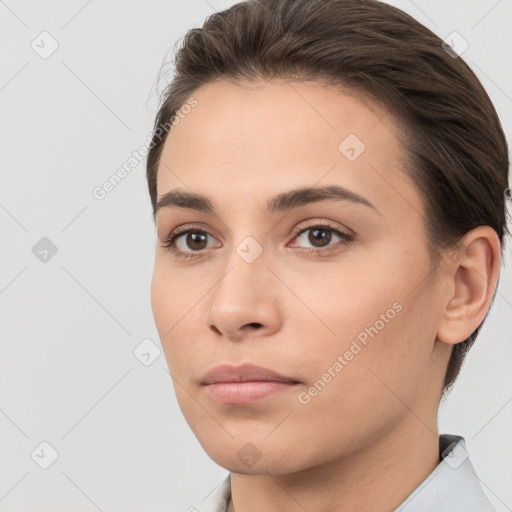 Neutral white young-adult female with short  brown hair and brown eyes