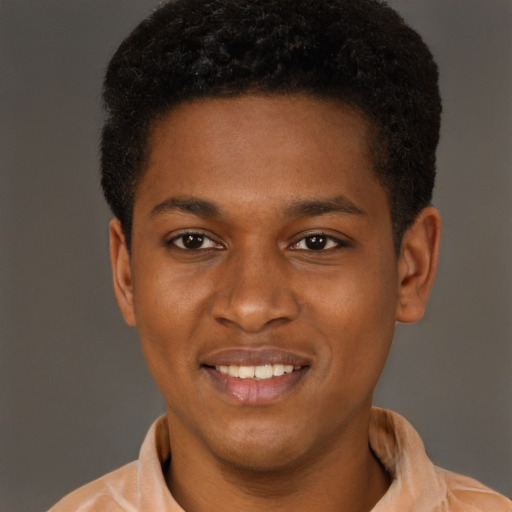 Joyful latino young-adult male with short  brown hair and brown eyes