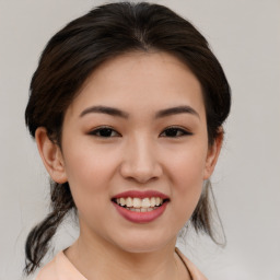 Joyful asian young-adult female with medium  brown hair and brown eyes