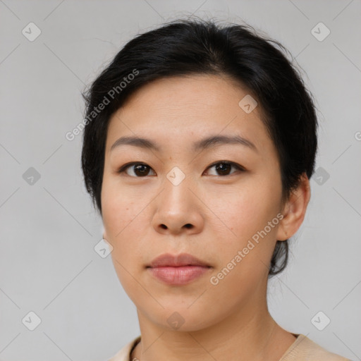 Neutral asian young-adult female with medium  brown hair and brown eyes