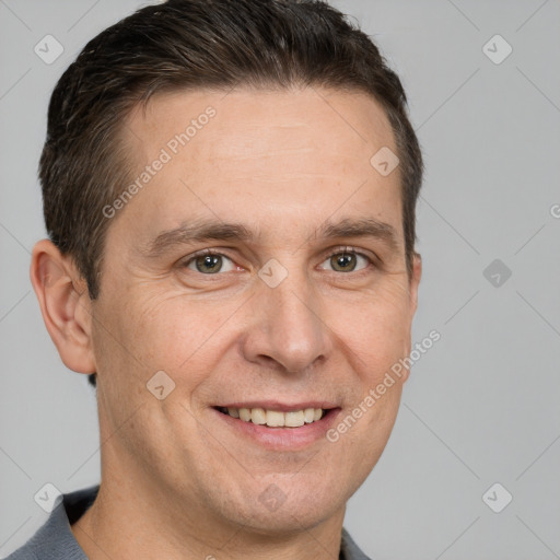 Joyful white adult male with short  brown hair and grey eyes